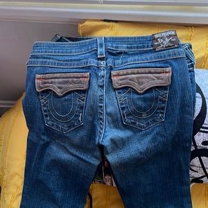 True Religion size 31 blue jeans with leather accents on pockets